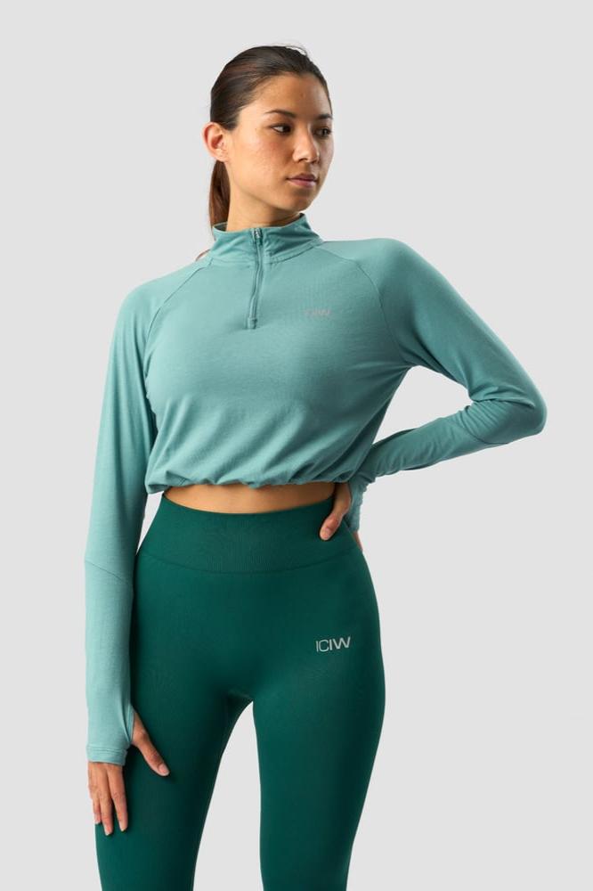 define cropped 1/4 zip adjustable mineral green