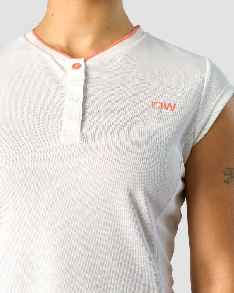 training pique polo white/coral wmn